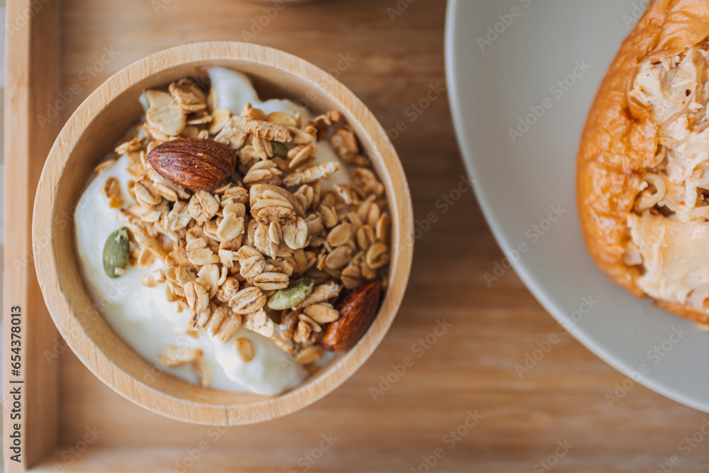 Close up of homemade breakfast. cereal granola in wooden bowl. Close up of homemade breakfast. cereal granola in wooden bowl.