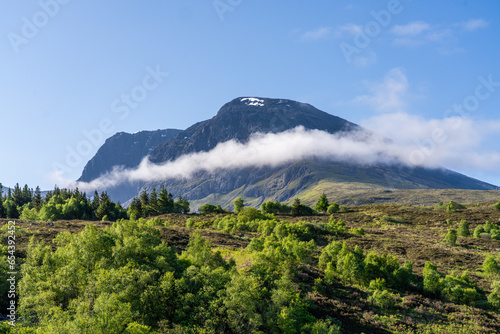 Ben Nevis With a Cloud Below the Summit and a Forest in the Foreground in Scotland United Kingdom photo