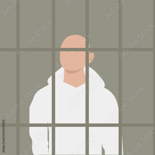 prisoner behind bars  in a white sweatshirt