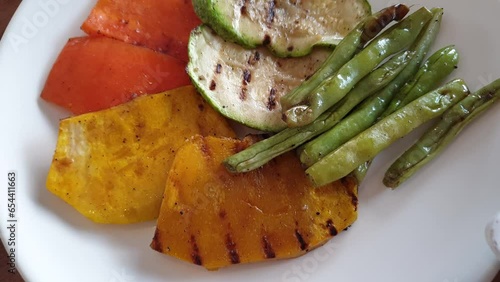 Vegetarian healthy vegatable side food zucchini carrot green bean pumpkin grill roast with olive oil photo