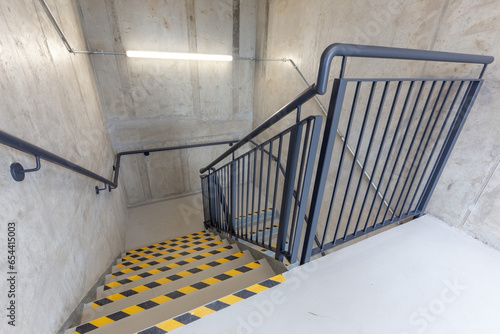 Multi-flight stairway with stainless handrails. FIRE ESCAPE. EMERGENCY EXIT. FIRE EXIT. High quality photo
