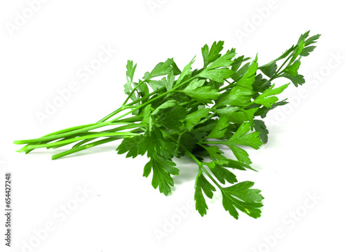 A bunch of parsley on a white background. Fresh fragrant herbs for cooking.