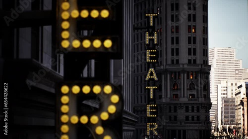 A sign that says the theater is lit up