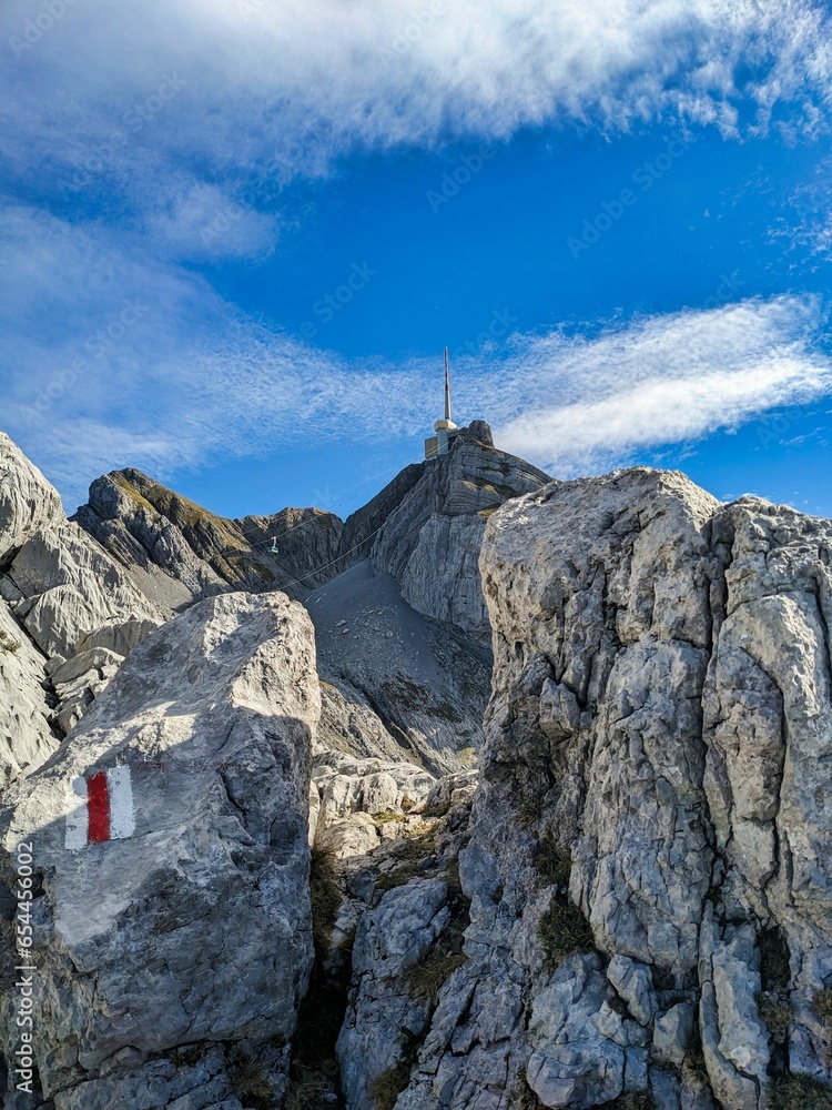 Fototapeta premium Hike to the Säntis in the Alpstein Appenzell. Beautiful autumn weather with fantastic views of the summit. Excursion destination in Eastern Switzerland. High quality photo