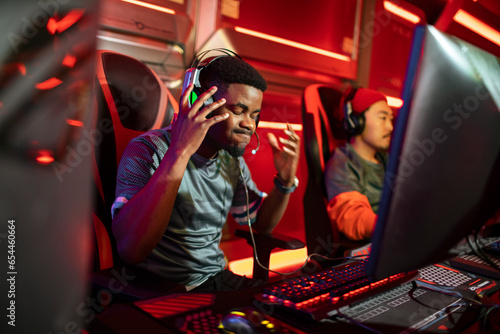 Professional male gaming team participating in a eSport tournament