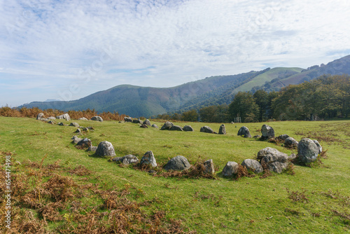 Stone circle Cromlech of Oianleku Harrespila with beautiful mountain landscape in autumn, Aiako Harria, Basque Country, Spain