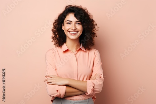 Confident Brunette Woman Posing with Crossed Arms, Isolated Studio Portrait - Testimonial of Beauty, Joy, and Authenticity