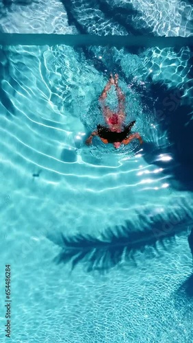 Aerial View of women swimming in swimming pool in Zanzibar