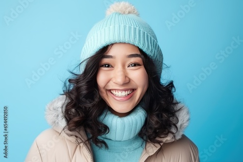 Smiling asian girl in warm winter outfit. Healthy, happy young woman © netrun78