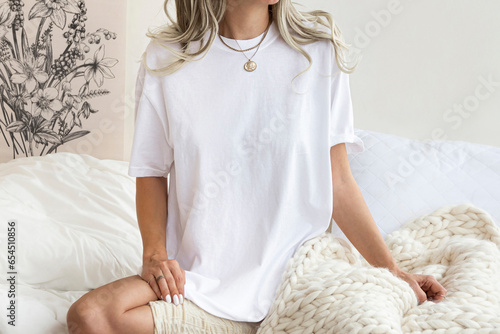 Young girl wearing blank oversized white t shirt mock up 1717 , for home boho designs. White tshirt for your design photo