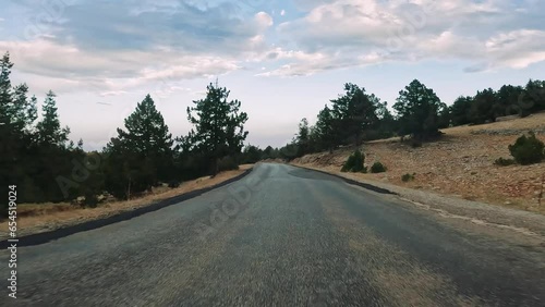 Road trip by car along the mountain roads and serpentines on sanset of Turkey. photo