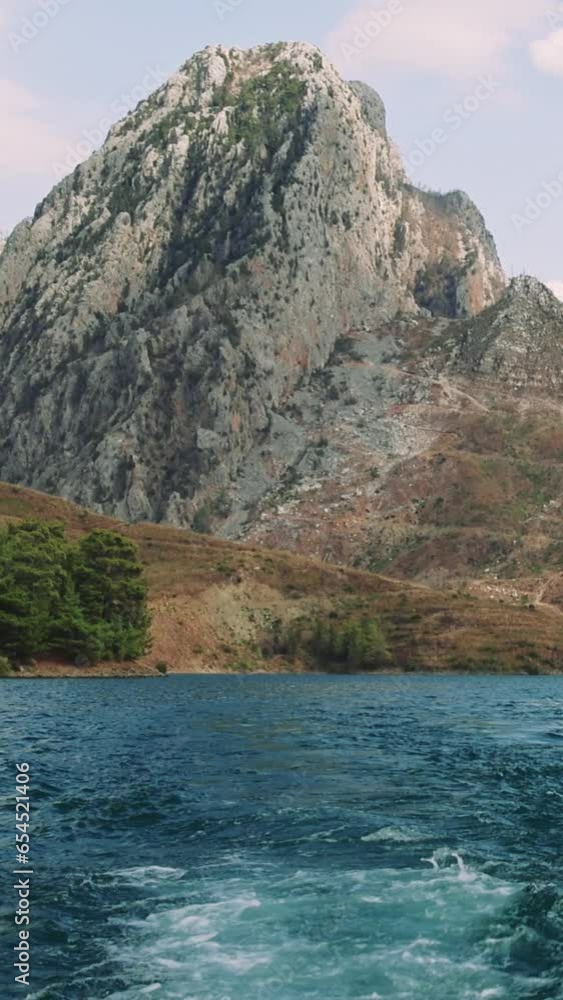 Sailing a boat on a beautiful lake among the mountains. 4K Sailing a boat on a beautiful lake among the mountains. 4K