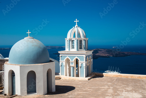 Blue dome tower church in a beautiful blue summer landscape in Santorini, Greece