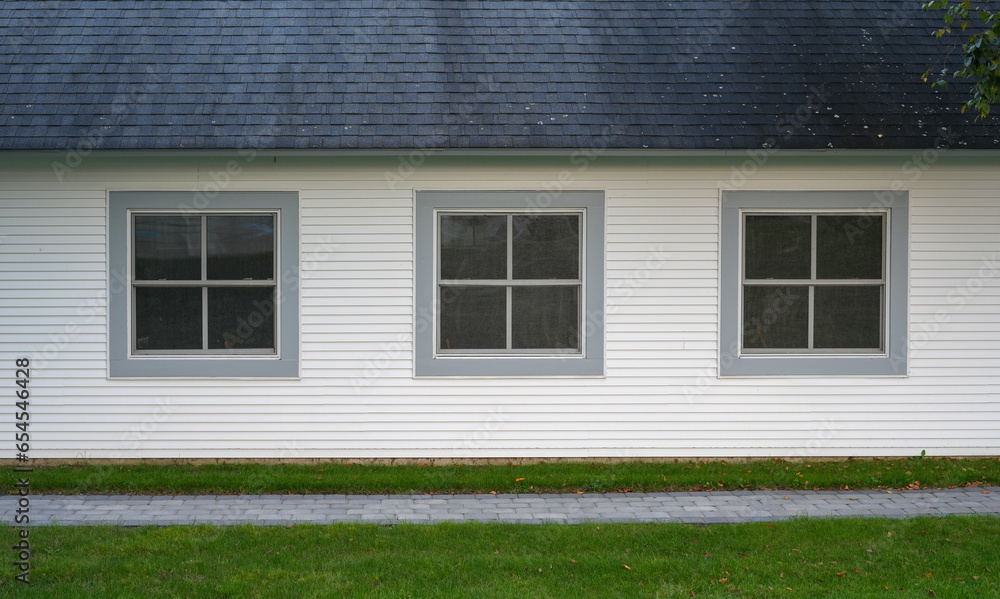 exterior facade view of house with three windows