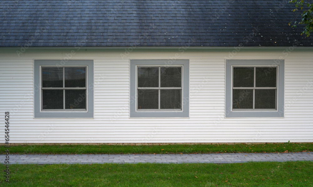 exterior facade view of house with three windows exterior facade view of house with three windows
