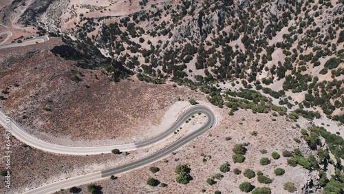 Drone shot of curvacious mountain roads near Sfakia South Crete. Greek roads filmed from bird's eye perspective. High quality 4k footage photo