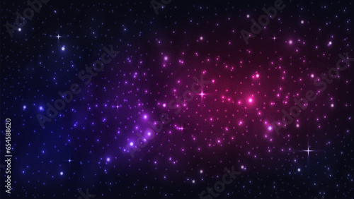 A starry sky with blurred smoke and the milky way on a dark background. Space in blue pink and purple on a dark background.