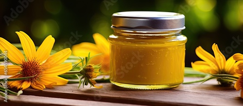 Homemade salve made from arnica for natural healing photo