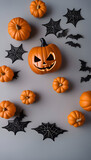 Halloween background with pumpkins. spiders and bats on grey background