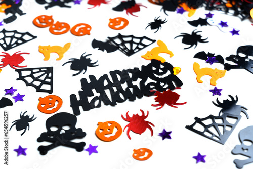 Fototapeta Naklejka Na Ścianę i Meble -  Assorted halloween confetti., jack-o-lantern, skeletons, skulls, spiders, bats