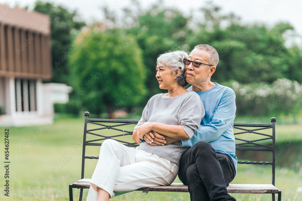 Asian people mature husband and wife, seated on chairs, elderly couple, seated in the park on comfortable chair, deep love and lifelong. Elderly Love Senior Couples, long life togetherness Asian people mature husband and wife, seated on chairs, elderly couple, seated in the park on comfortable chair, deep love and lifelong. Elderly Love Senior Couples, long life togetherness