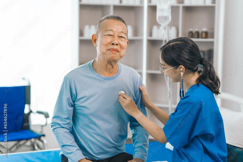 Elderly man engages in thoughtful discussion with compassionate asian people female doctor, addressing health agenda and medical concerns, exemplifying importance of patient-centered care. Elderly man engages in thoughtful discussion with compassionate asian people female doctor, addressing health agenda and medical concerns, exemplifying importance of patient-centered care.