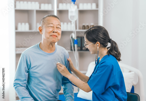 Elderly man engages in thoughtful discussion with compassionate asian people female doctor  addressing health agenda and medical concerns  exemplifying importance of patient-centered care.