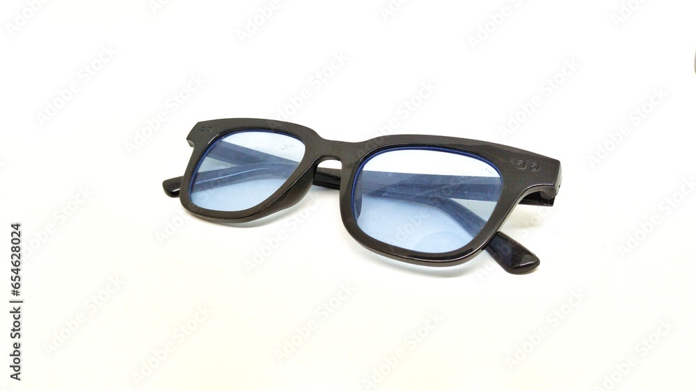 Fototapeta premium blue lensed sun glasses on a white background