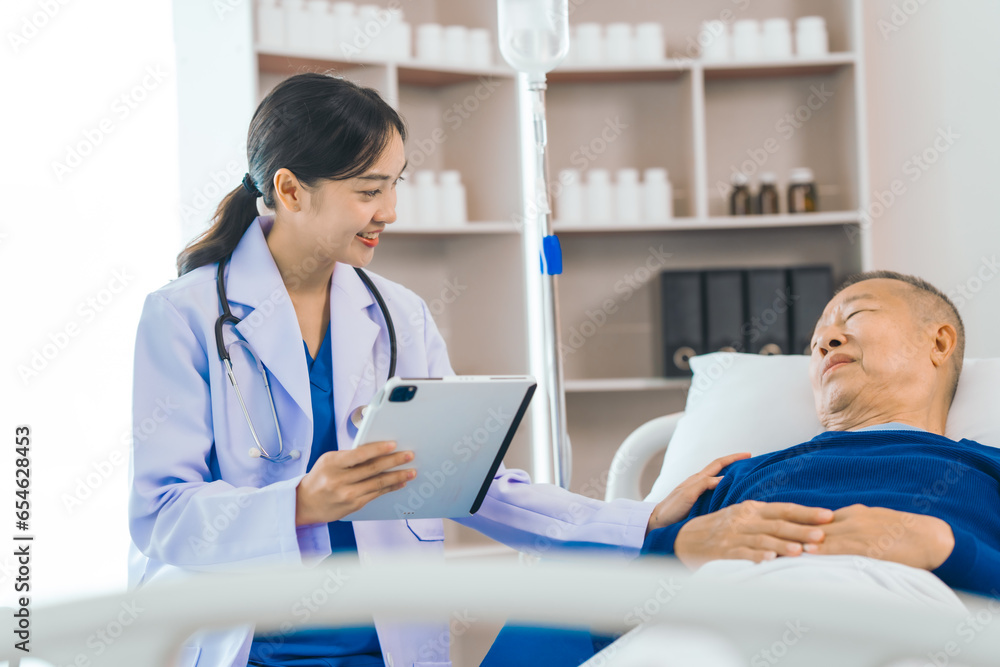 Caring female doctor provides attentive medical care to asian people elderly man lying in hospital bed, highlighting importance of expert healthcare and support during times of illness. Caring female doctor provides attentive medical care to asian people elderly man lying in hospital bed, highlighting importance of expert healthcare and support during times of illness.