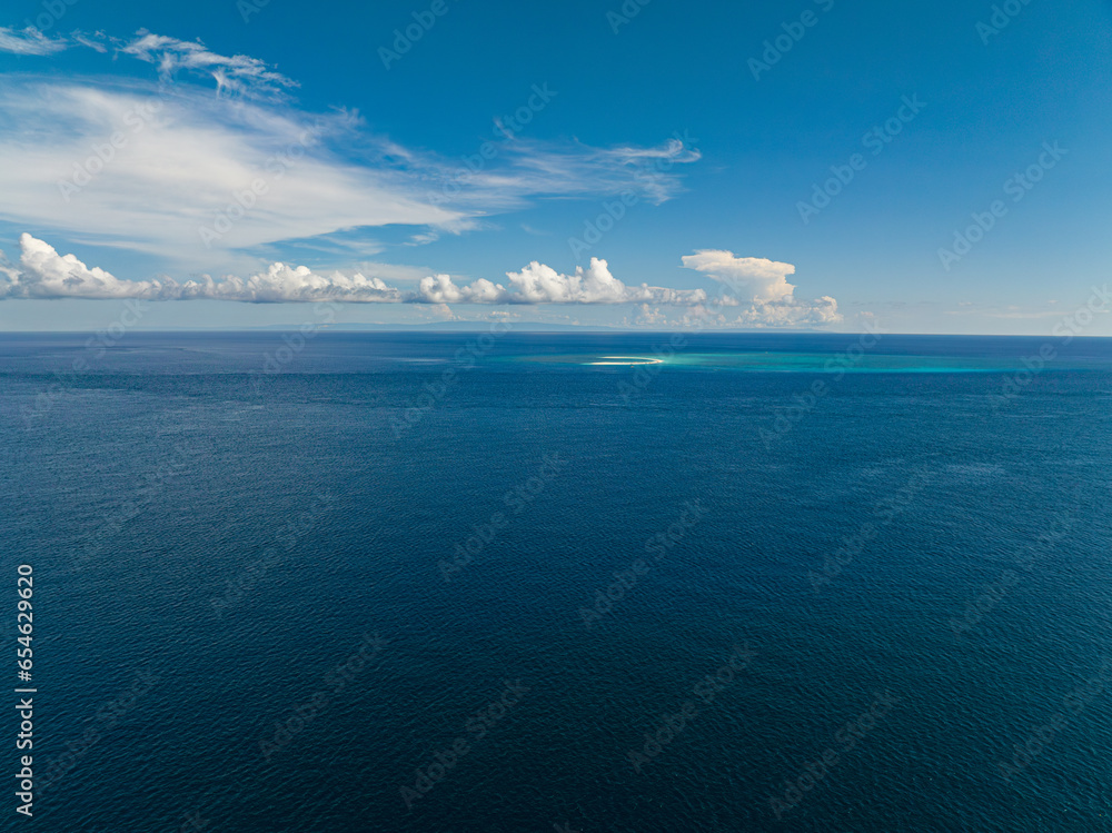 Blue ocean in sea surface. Blue sky with cloud. Mindanao, Philippines. Blue ocean in sea surface. Blue sky with cloud. Mindanao, Philippines.