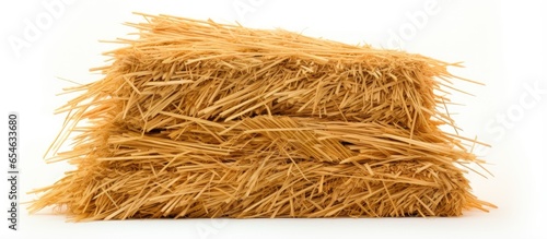 Gold haystack on white background is a compact bundle of straw