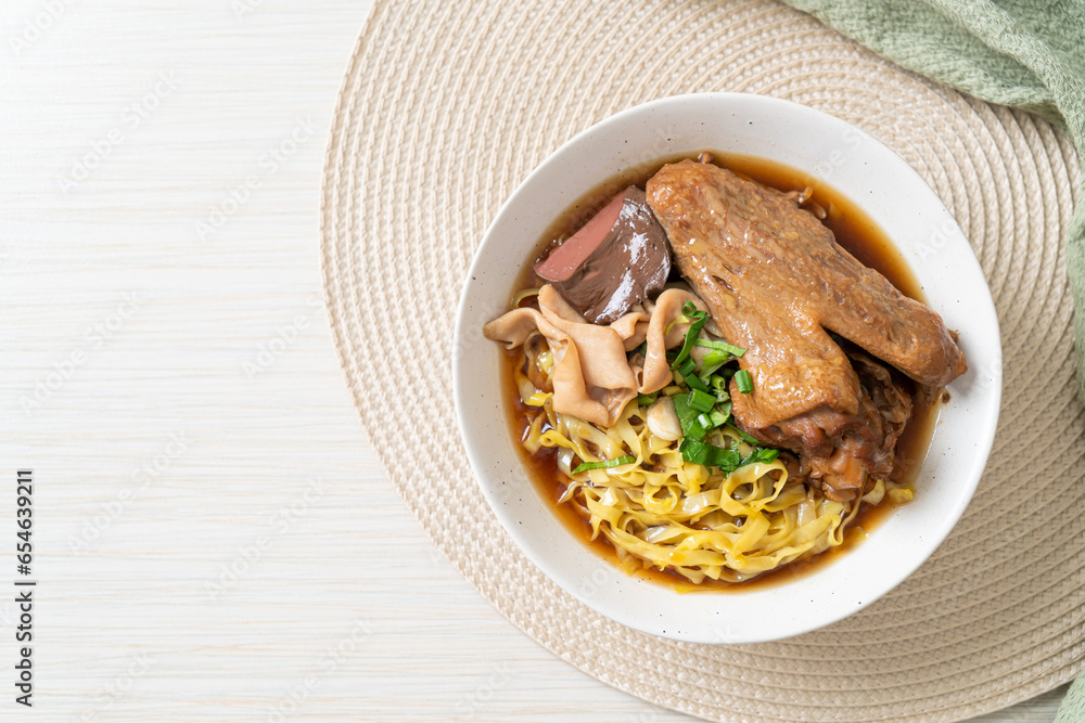 egg noodles with stewed and braised duck in brown soup