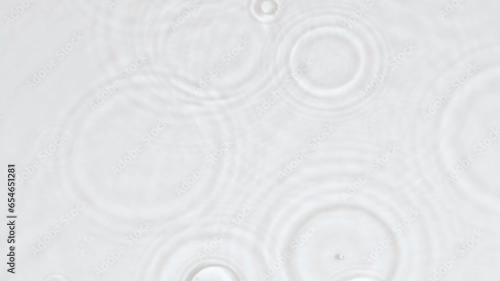 Slowmo falling rain drops, transparent water surface splash, ripple wave texture