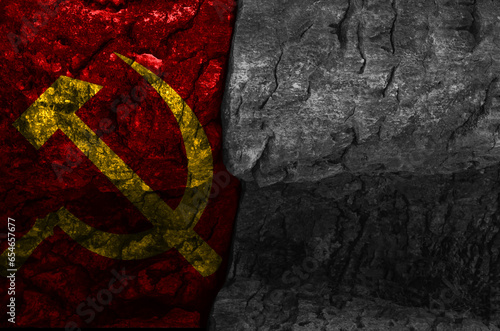 communist flag with natural stone texture with black and white negative space, cracked stone texture photo