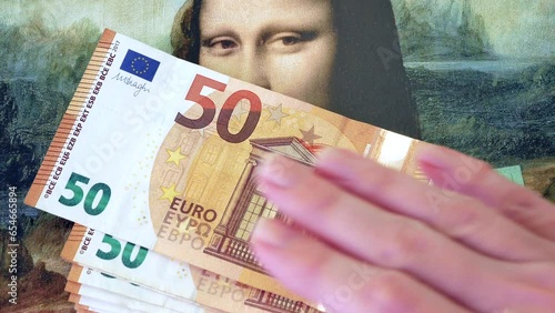 A lot of euro money against the background of an old painting Mona Liza La Gioconda from Leonardo Da Vinci, money for art photo