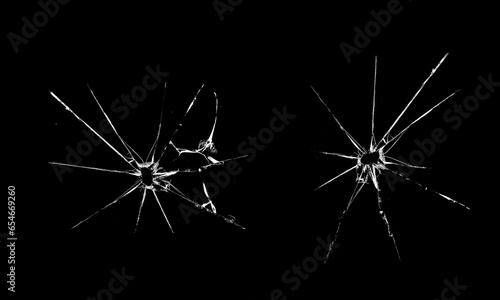 Cracked glass window. Texture of craced glass. Isolated realistic cracked glass effect.  Bullet holes.  Abstract black and white 3D illustration 