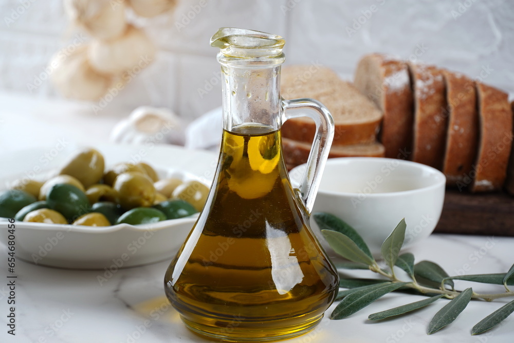 Olive oil and Olives, olive branch , on background Olive oil and Olives, olive branch , on background