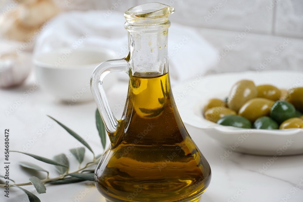 Olive oil and Olives, olive branch , on background Olive oil and Olives, olive branch , on background