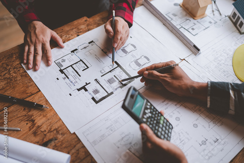 Structural engineer team discussing and calculating work Office design of the building structure concept of the construction project. building model meeting concept business objects