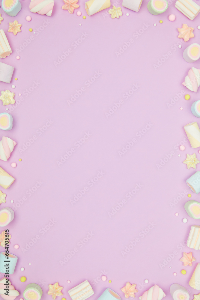 Cute pastel purple kawaii background with frame of sweet meringue and marshmallows . Flat lay, top view, copy space. Beautiful childlike design template Cute pastel purple kawaii background with frame of sweet meringue and marshmallows . Flat lay, top view, copy space. Beautiful childlike design template