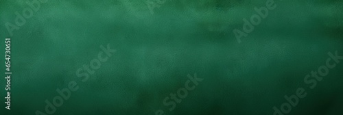 Green Suede background texture, flat and smooth, enhances the luxury of your space, creating a tactile canvas for a sophisticated web banner that elevates visual appeal with its refined surface photo