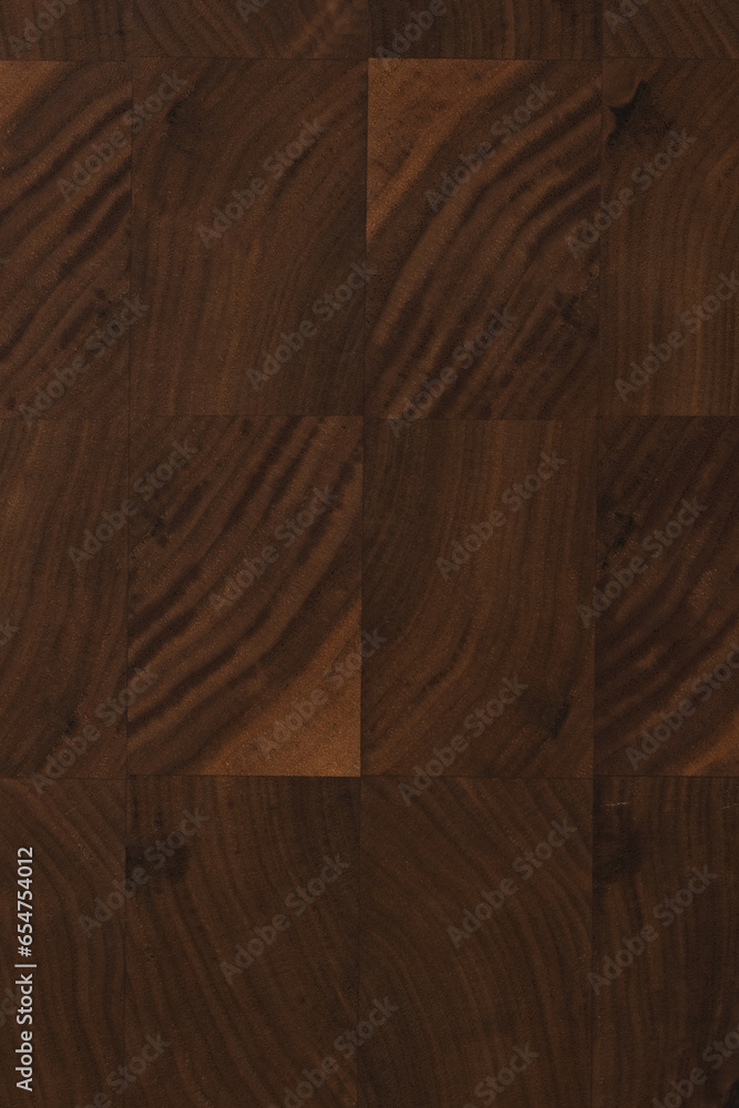 Black walnut end grain wood cutting board texture with oil finish closeup