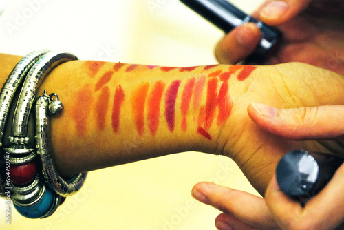 Konstfotografi Lipstick colours tast product on the wrist before buy.