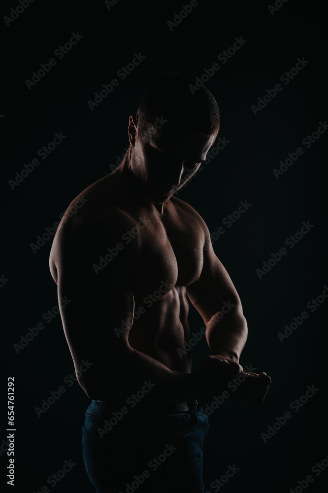 Stunning and well-built man flexing his chest and bicep Stunning and well-built man flexing his chest and bicep