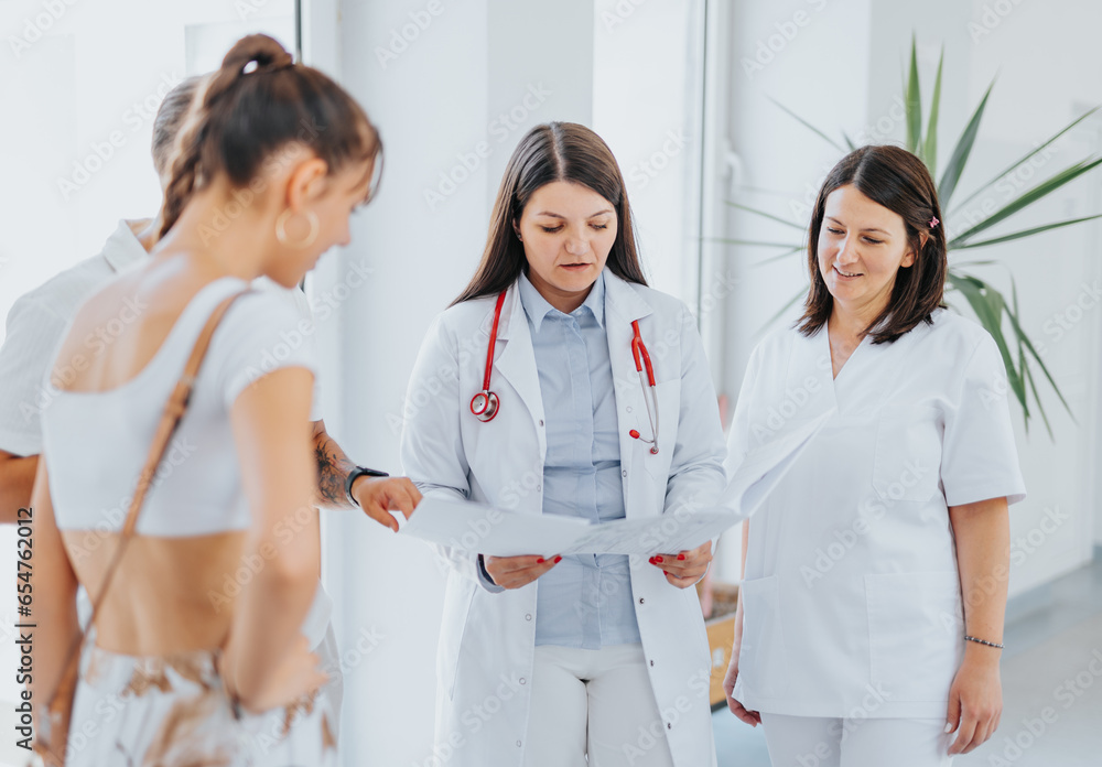 Fototapeta premium Experienced Female Doctors Providing Healthcare Solutions at Hospital Hall