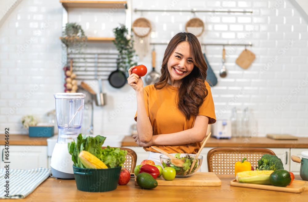 Portrait of beauty body slim healthy asian woman having fun cooking and preparing cooking vegan food healthy eat with fresh vegetable salad on counter in kitchen at home.Diet concept.Fitness, healthy Portrait of beauty body slim healthy asian woman having fun cooking and preparing cooking vegan food healthy eat with fresh vegetable salad on counter in kitchen at home.Diet concept.Fitness, healthy