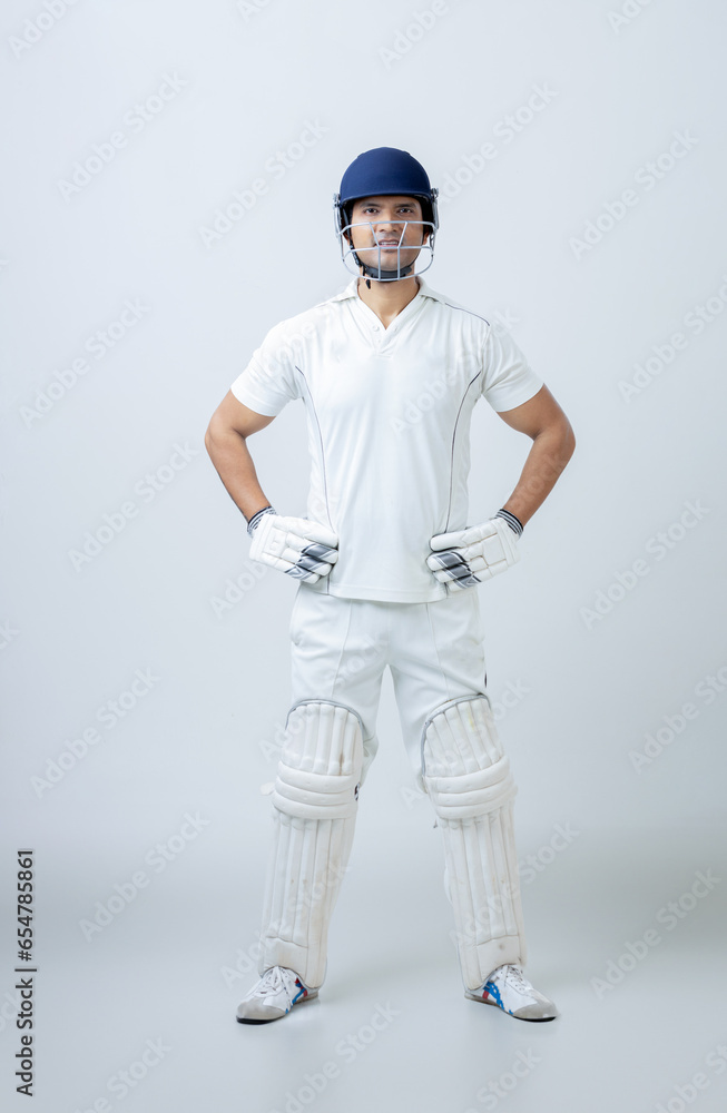 Full body portrait of Man in cricketer dress on isolated background looking towards the camera, cricket concept Full body portrait of Man in cricketer dress on isolated background looking towards the camera, cricket concept