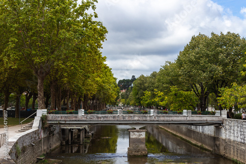 Leiria, Portugal, August 29, 2021: View of Lis River in the city of Leiria, Portugal. Leiria is a city and a municipality in the Center Region of Portugal. Bridge over River Lis and Polis Via. photo