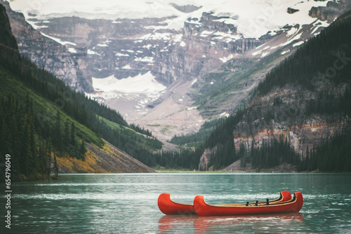 Boats in front of mountain.