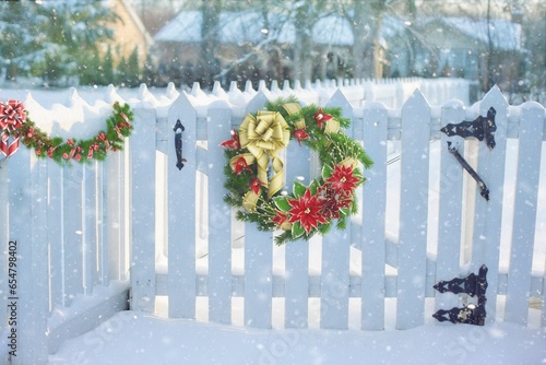 Christmas Flower Decoration on Fence in Snow